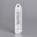 A white Taylor wall thermometer.