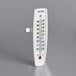 A Taylor outdoor window thermometer with a white background and metal clip.