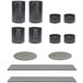 A black matte stainless steel container with white dots on the sides and holes in the bottom, set on a table.