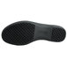 The black sole of a Genuine Grip women's leather shoe.