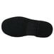 The black rubber sole of a Genuine Grip black leather oxford shoe.