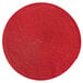 A red woven round RITZ® placemat.