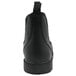 A close-up of a men's black leather non-slip boot with a black sole.