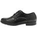 A Genuine Grip black leather oxford dress shoe with laces.