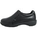 A black Genuine Grip slip-on leather shoe with a rubber sole.