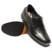 A Genuine Grip black leather men's slip-on dress shoe with a black rubber sole.