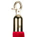 A red velvet rope with gold metal ends.