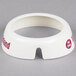 A white circular plastic collar with maroon lettering.