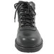 A close-up of a black Genuine Grip steel toe leather work boot with laces.