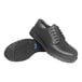 A pair of black Genuine Grip men's safety shoes with laces and rubber soles.