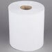 A Merfin white center pull paper towel roll on a white surface.