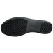 The black sole of a Genuine Grip black leather shoe.