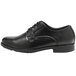 a black shoe with a white background