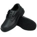 A pair of black Genuine Grip men's oxford work shoes with black rubber soles.