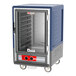 A blue Metro C5 heated holding cart with a clear door.
