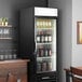 A Beverage-Air black glass door wine refrigerator full of wine bottles.