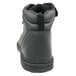 A close-up of a black Genuine Grip steel toe boot with a zipper on the side.