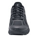 A close-up of a black Shoes For Crews Endurance II men's athletic shoe.