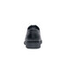 The back of a black Shoes For Crews Senator men's dress shoe on a white background.