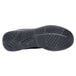 The black rubber sole of a Shoes For Crews Evolution II men's athletic shoe.