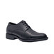 A close up of a black leather Shoes For Crews Senator dress shoe with laces.