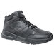 A black Shoes For Crews men's athletic shoe with laces.