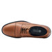 A brown Shoes For Crews men's derby shoe with black laces and a black sole.