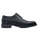A black leather Shoes For Crews Senator dress shoe with laces and a rubber sole.