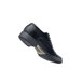 A black Shoes For Crews Senator dress shoe with a rubber sole.