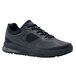 A close-up of a black Shoes For Crews Evolution II men's athletic shoe with laces.