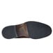 The brown sole of a Shoes For Crews Senator men's dress shoe.