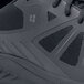 The black sole of a Shoes For Crews Endurance II athletic shoe.
