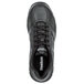 A close-up of a black Reebok athletic shoe with white text.
