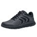 A black Shoes For Crews athletic shoe for women with laces.