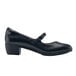 A black women's Shoes For Crews Vita dress shoe with a buckle.