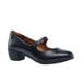 A black leather Shoes For Crews Vita women's dress shoe with a buckle strap.