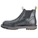 A black work boot with a yellow sole.