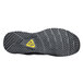 The sole of a black ACE Aster athletic shoe with yellow accents.