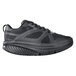 A black Shoes For Crews athletic shoe with a mesh upper.