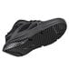 A black Shoes For Crews athletic shoe with a sole.