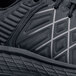 A close up of a black ACE Trident III men's athletic shoe.