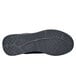 The black sole of a black Shoes For Crews Revolution II women's athletic shoe.