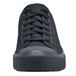 A black Shoes For Crews Delray women's shoe with laces on a table.