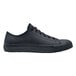 A black leather Shoes For Crews women's sneaker with laces and a rubber sole.