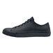 A black Shoes For Crews Delray women's casual shoe with laces.