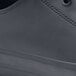 A close up of a black leather Shoes For Crews Delray shoe.