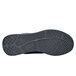 The sole of a black Shoes For Crews Revolution II women's athletic shoe.