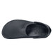 A close-up of a black Shoes For Crews Zinc casual shoe with rubber soles.