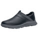 A black women's slip-on shoe with grey soles.