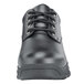 A black Shoes For Crews work boot with laces and a rubber sole.